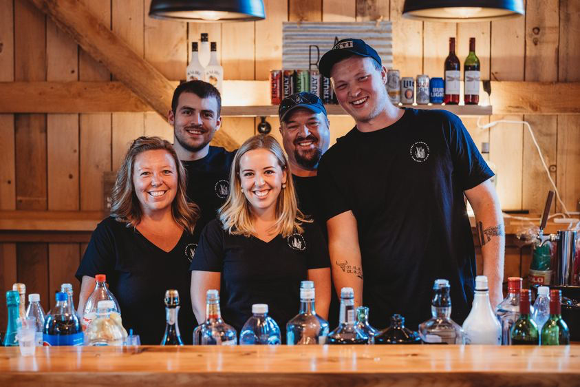 The indoor bar and bartenders inside the Sunset Meadows barn