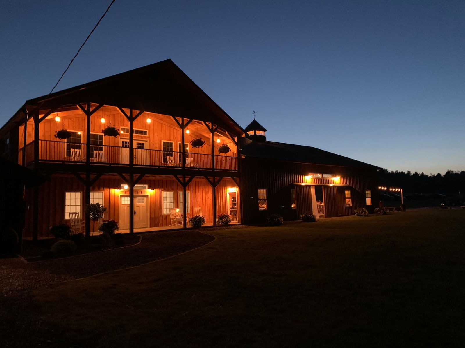 The barn glowing at dusk at Sunset Meadows